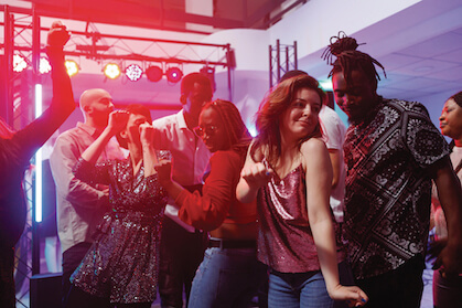 A group of people dancing next to each other