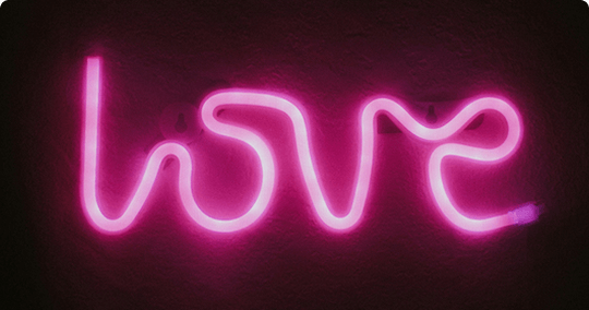 A 'Love' LED neon pink sign 