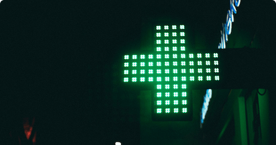 A cross neon green light